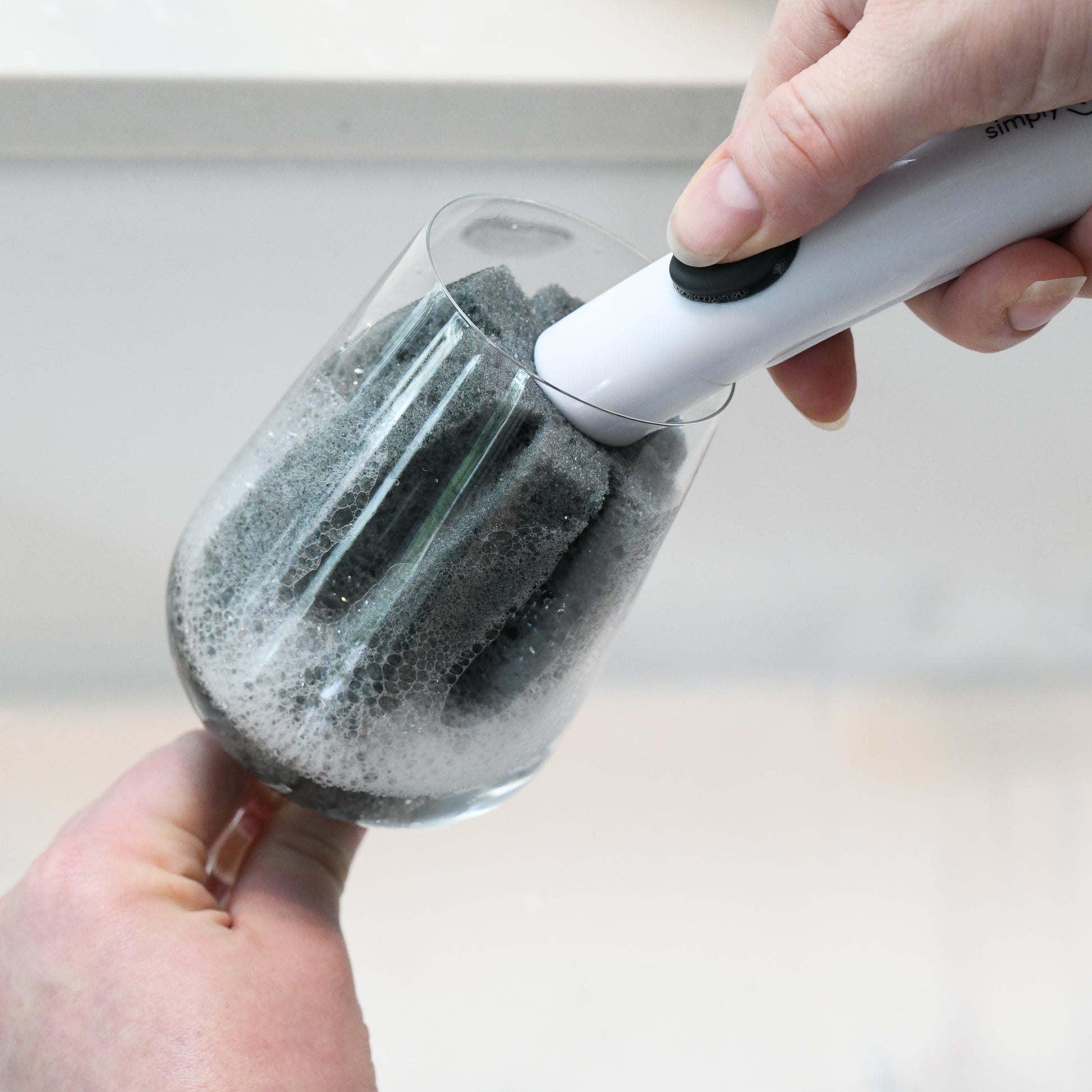 The WINE Brush dispenses soap to make this an all in one wine glass cleaning tool